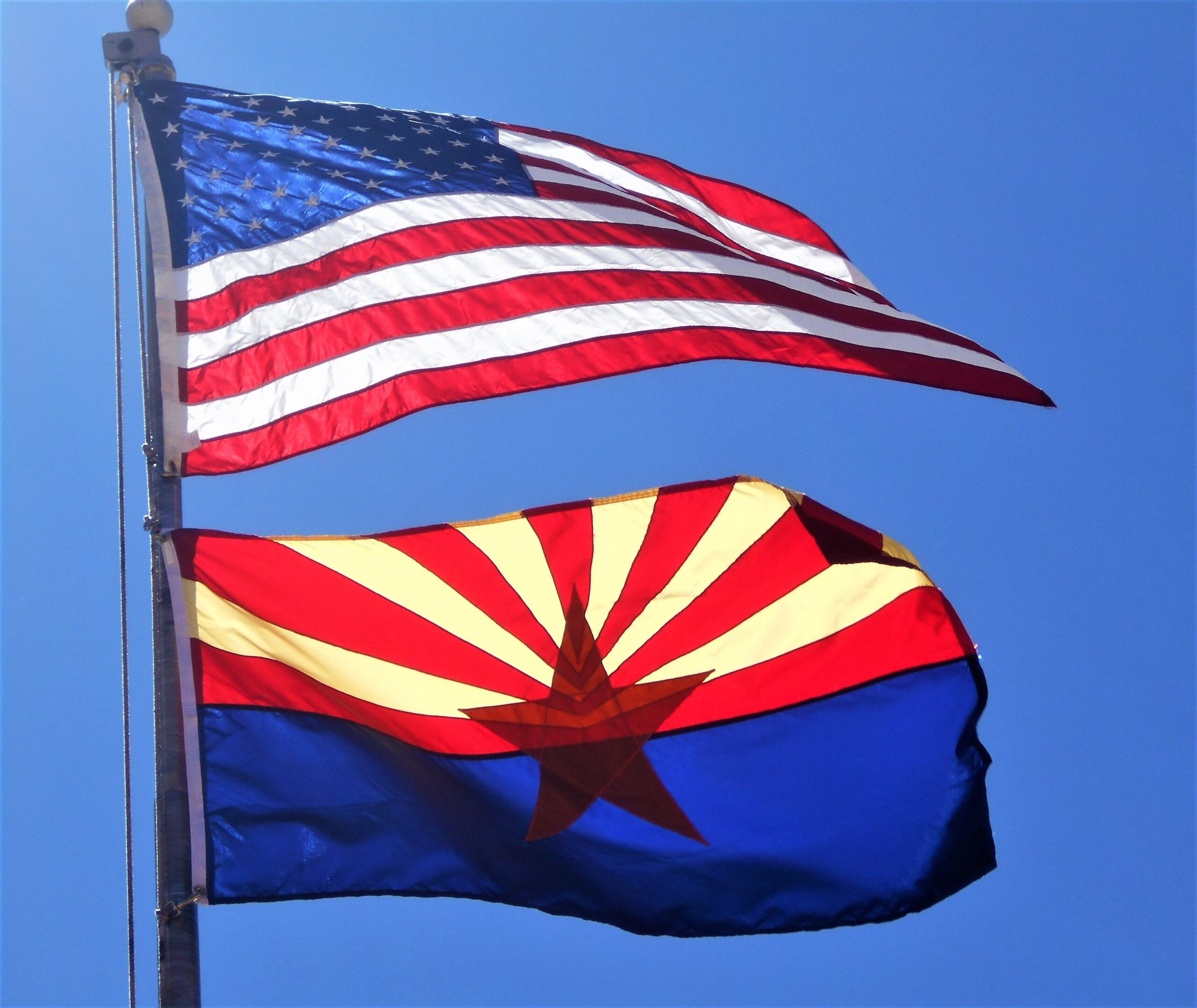 american flag flown with the state of arizona flag