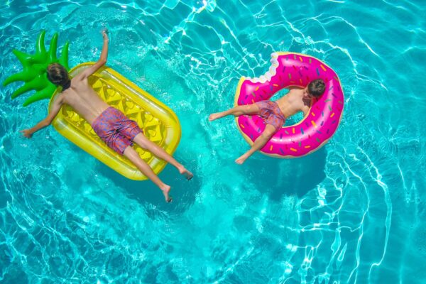 Kids with floats in a pool