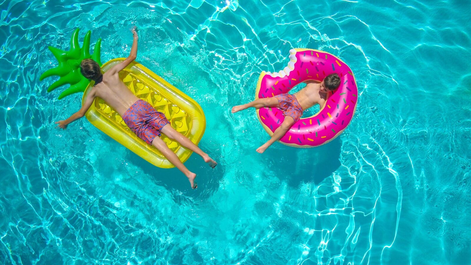 Kids with floats in a pool