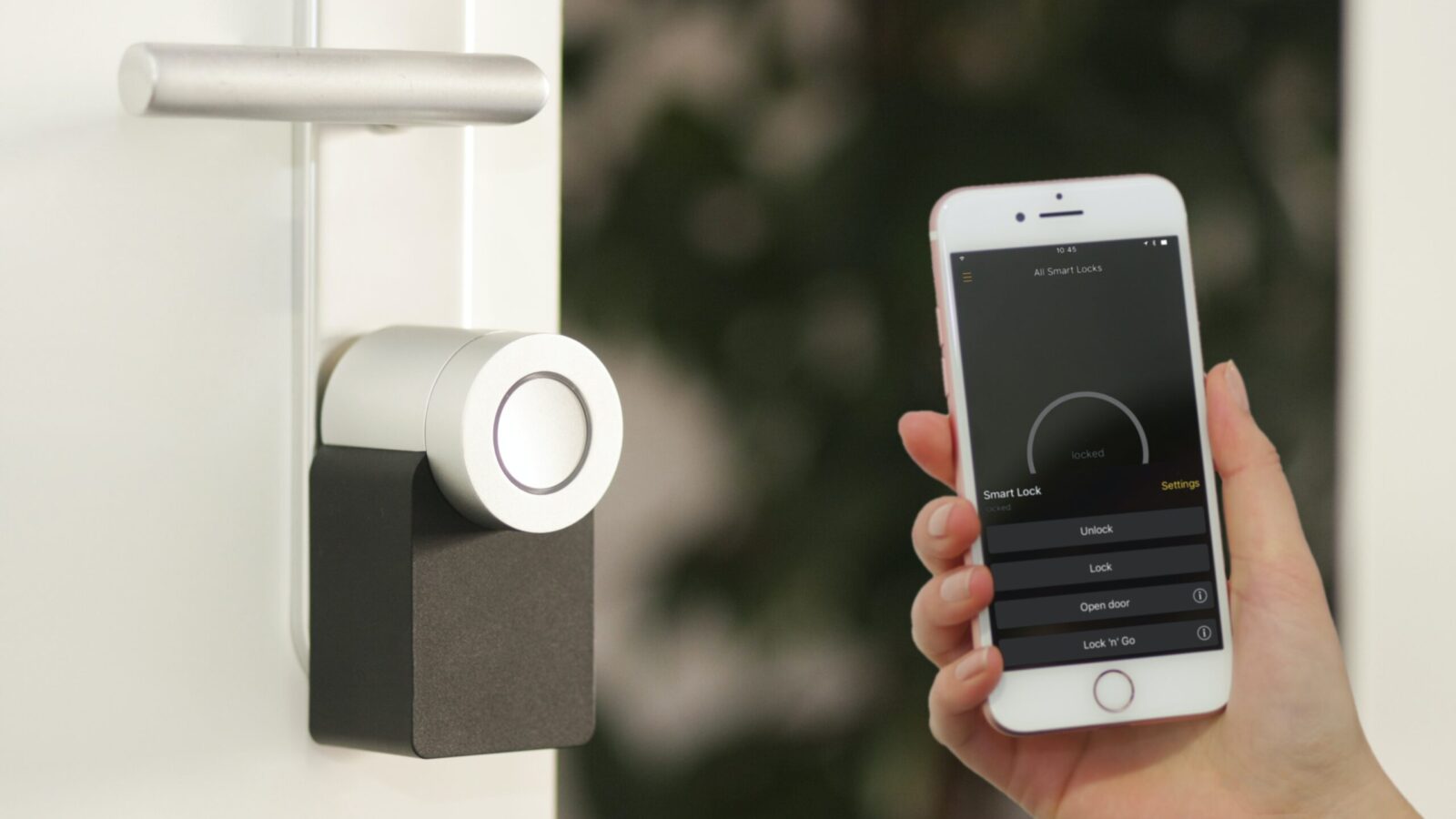 smart phone held up to a smart door lock